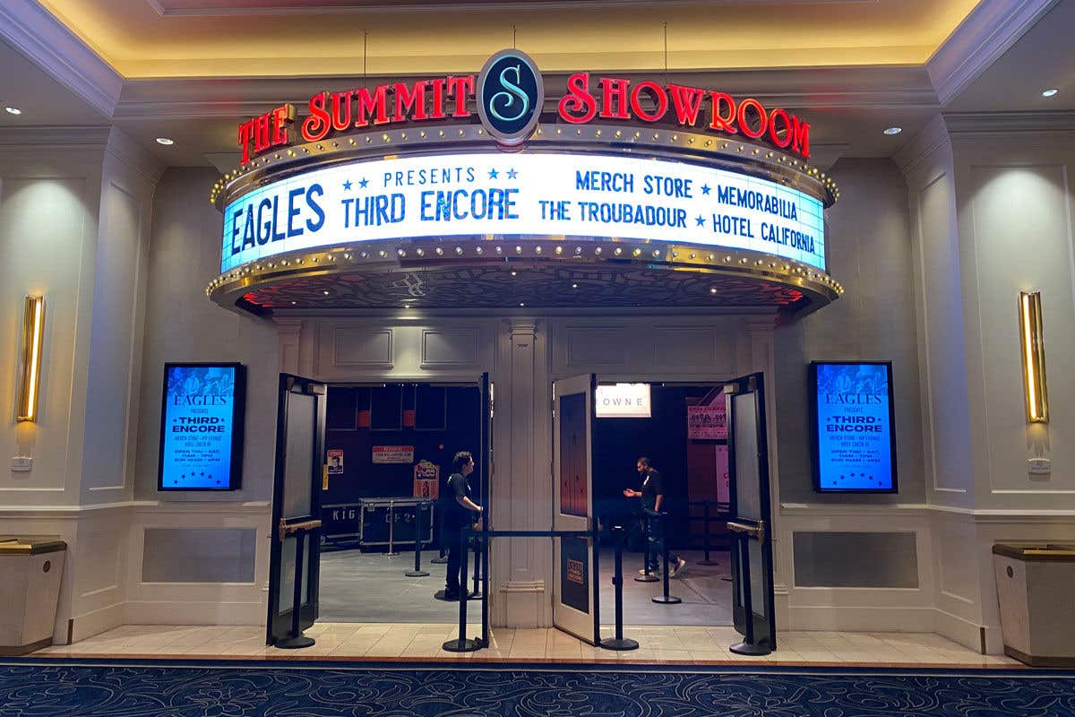 Entrance to The Summit Showroom featuring Eagles Third Encore pop up with doors open and two gentlemen inside. 