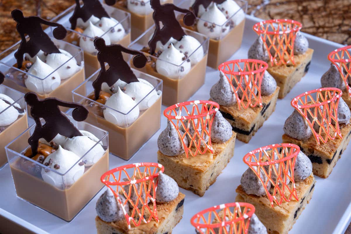 Closeup of small basketball-themed desserts.